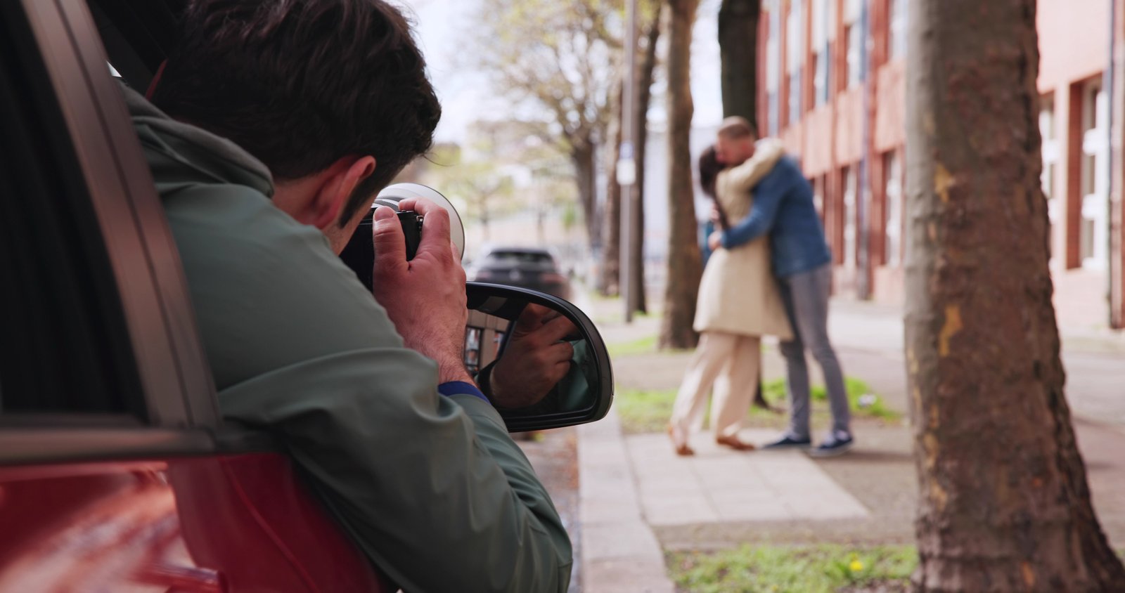A private investigator takes a photo