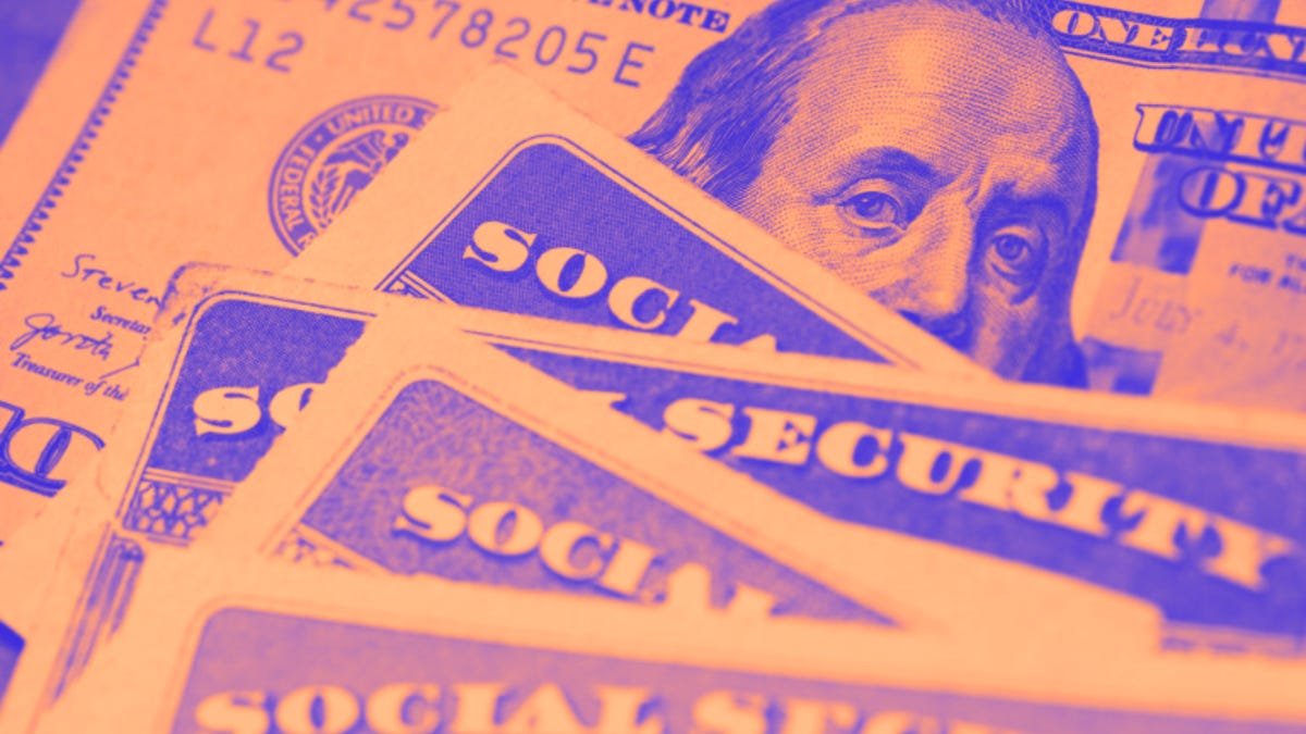 Social security cards and dollar bills