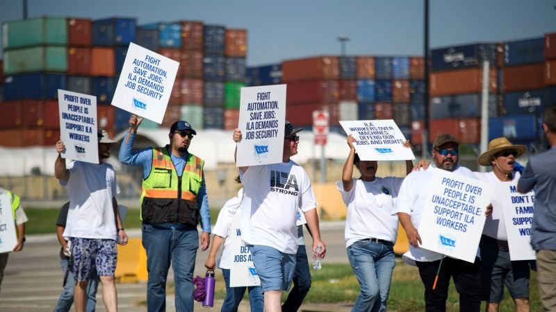 Striking port workers to return to work Friday as negotiators reach an agreement on wages